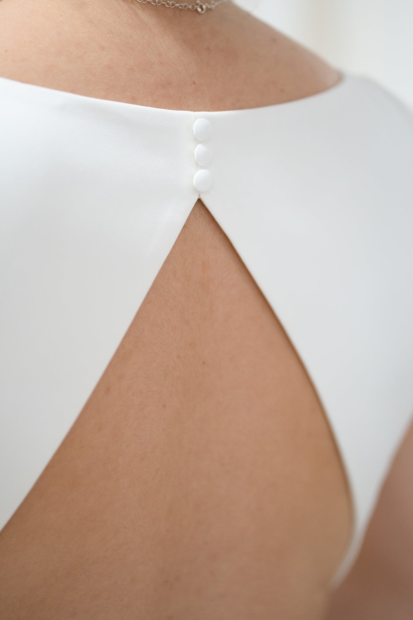 V-NECK DRESS WITH TRIANGULAR OPEN BACK